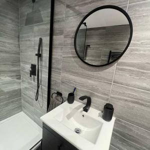 Bespoke annex bathroom showing sink and mirror
