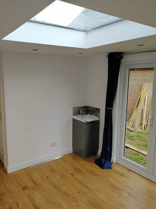 One of the office rooms, showing skylight, small office sink and skylights 